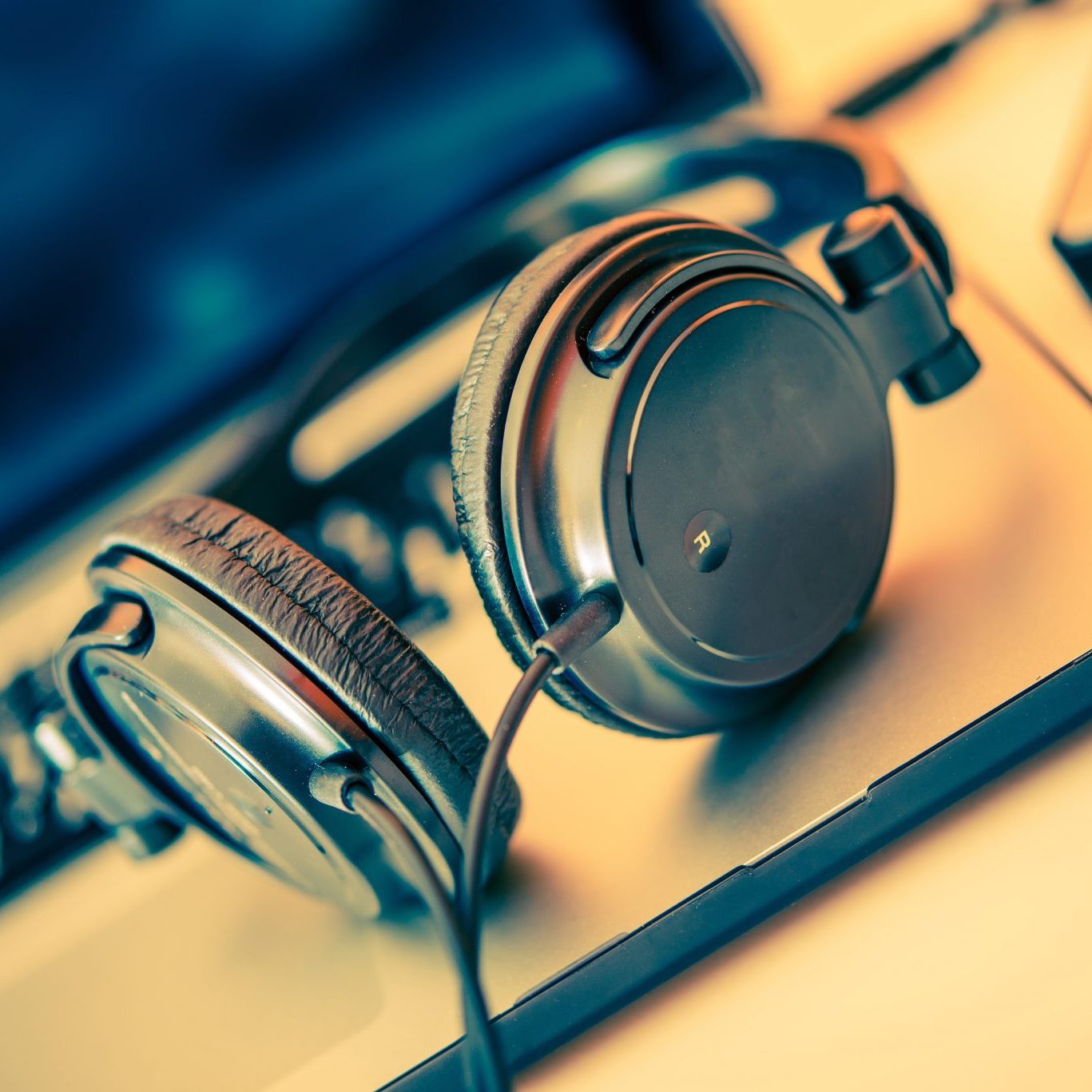 Headphones on Laptop Computer. Online Music Listening. Music Concept.